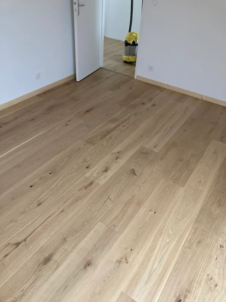 Light wood flooring installed in a bedroom